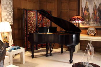 A STEINWAY & SONS BABY GRAND PIANO